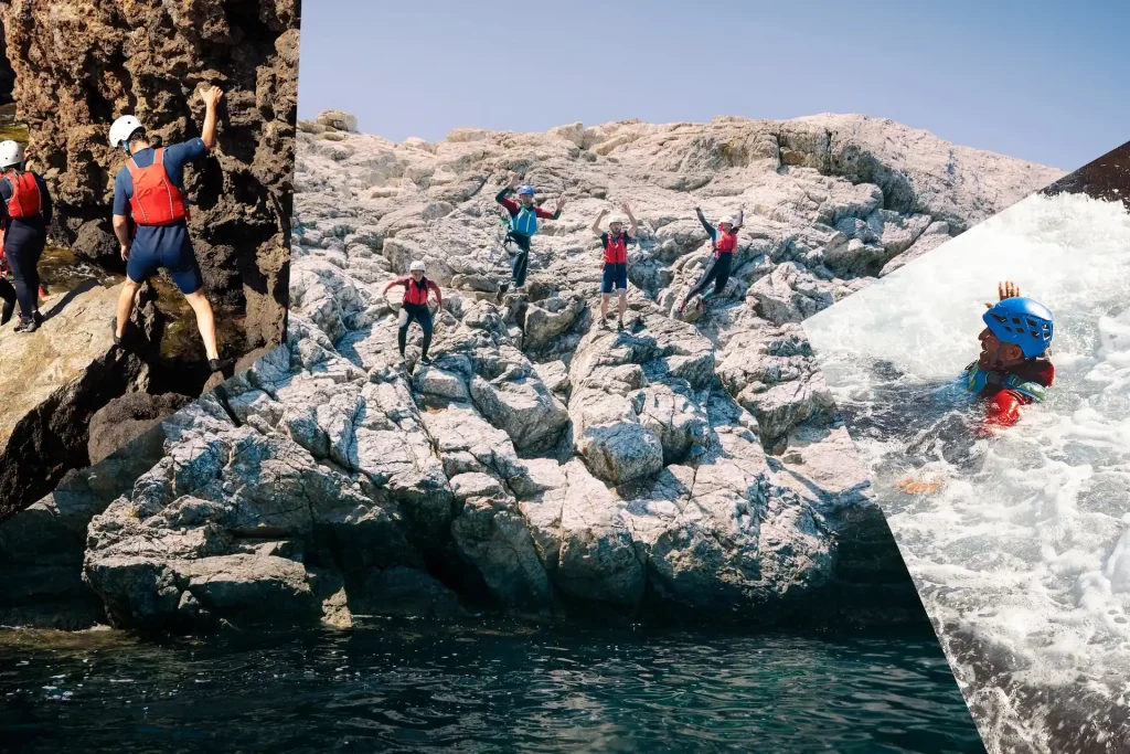 Grupo de aventureros saltando desde acantilados durante una experiencia de coasteering en Ibiza