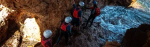 Discover hidden rocky channels and coastal formations during your coasteering adventure in Ibiza. Navigate through stunning turquoise waters and explore the island's wild coastline with expert guides.