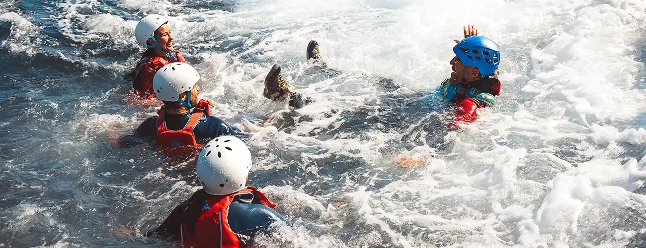 Families and beginners enjoying a safe guided coasteering experience in Ibiza