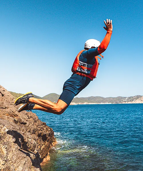 Launch into adventure with coasteering in Ibiza. Jump from natural rock formations along the island's stunning coastal cliffs. Guided tours with professional safety equipment included for an unforgettable Mediterranean experience.